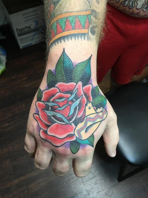 Red Rose on Hand by Cody Hennings TattooNOW